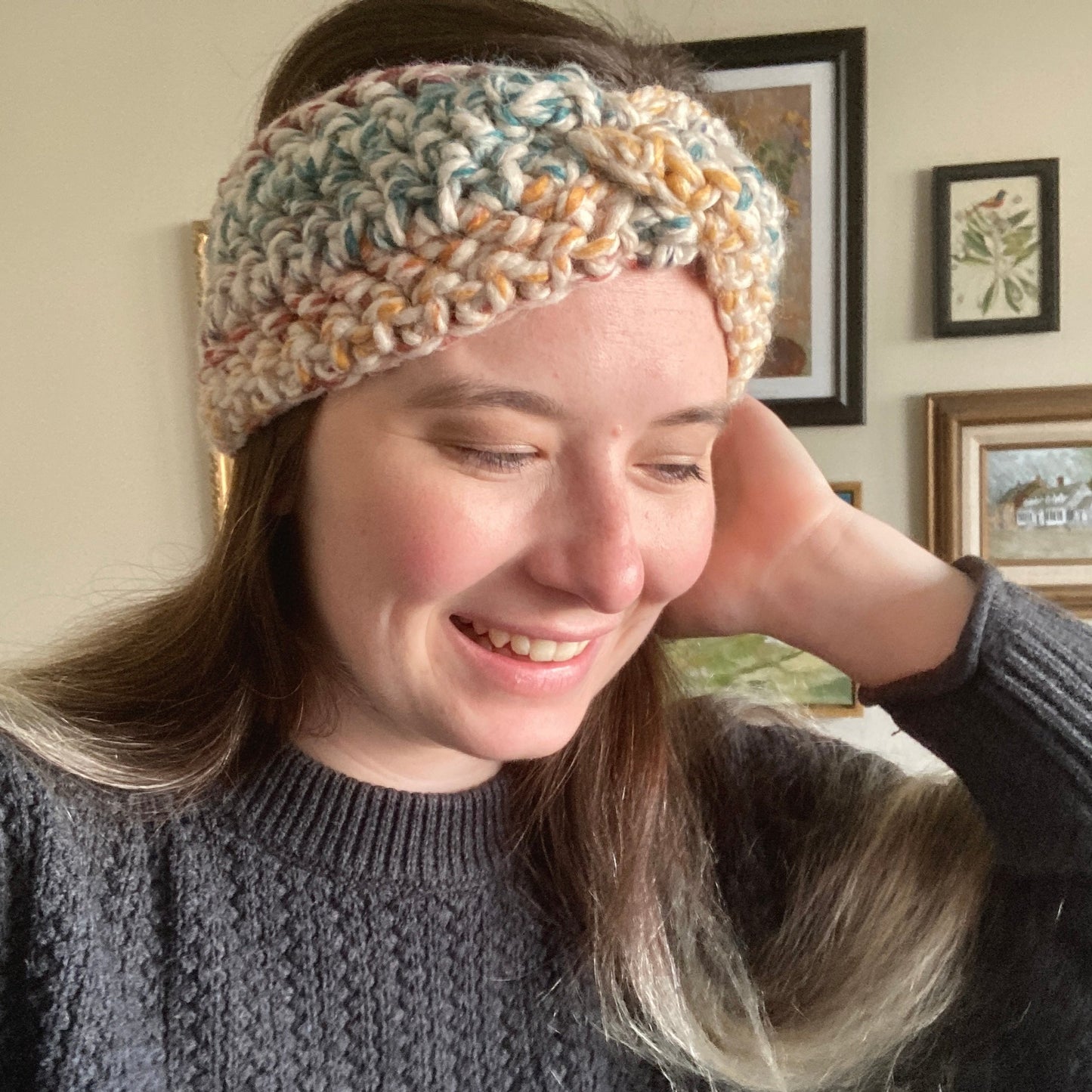 Leah wears Elizabeth Crochet Headband Twist with variegated rainbow yarn.